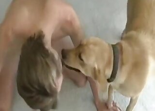 Gay zoophile rolls around on the floor to enjoy foreplay with a dog