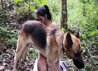 German Shepherd lets Latina lady do oral work on his shaft outdoors