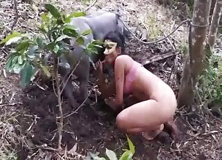 Latina cougar is filmed while sucking on long pig pole in forest