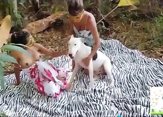 Outdoor fucking scene with a tanned Latina that fucks a dog hard