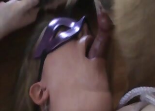 Purple mask lady worships a beast's cock and looks hot in the process