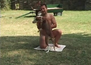 Naked zoophile does his best in order to fuck with a dog outdoors