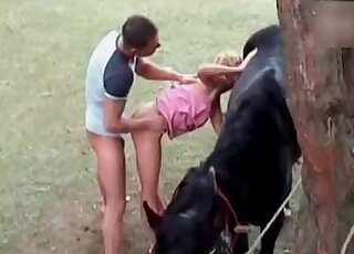 Mature zoophile slut gets a mouthful of cum from a horse and her fuckmate