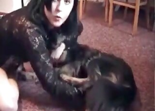 Brunette zoophile bitch passionately makes out with her black dog