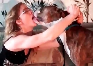 Nerdy MILF in glasses lets her dog bang her needy wet cunt