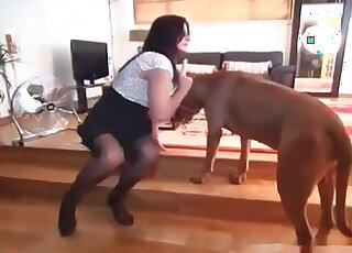 Pretty MILF trains her dog to sniff at her soaking needy pussy