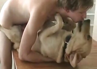 Dude kisses his dog and rams its pussy in a wild zoo porn session